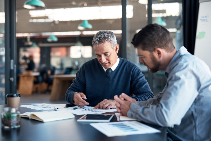 Two people speaking about work